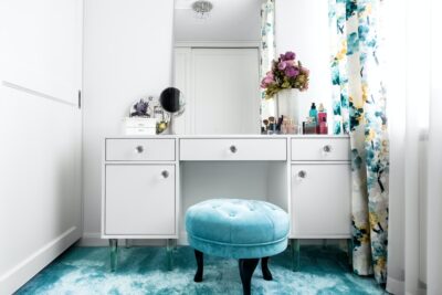 feminine dressing room with minimalist vanity table and mirror