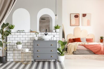 grey cabinet in open space interior with orange b